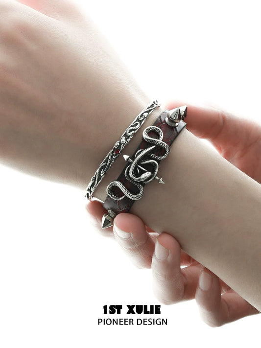 Gothic snake bracelet featuring silver snake design and spikes on leather strap