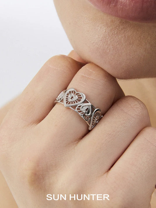 Sun Hunter heart lock ring in silver with intricate heart designs for elegant jewelry lovers