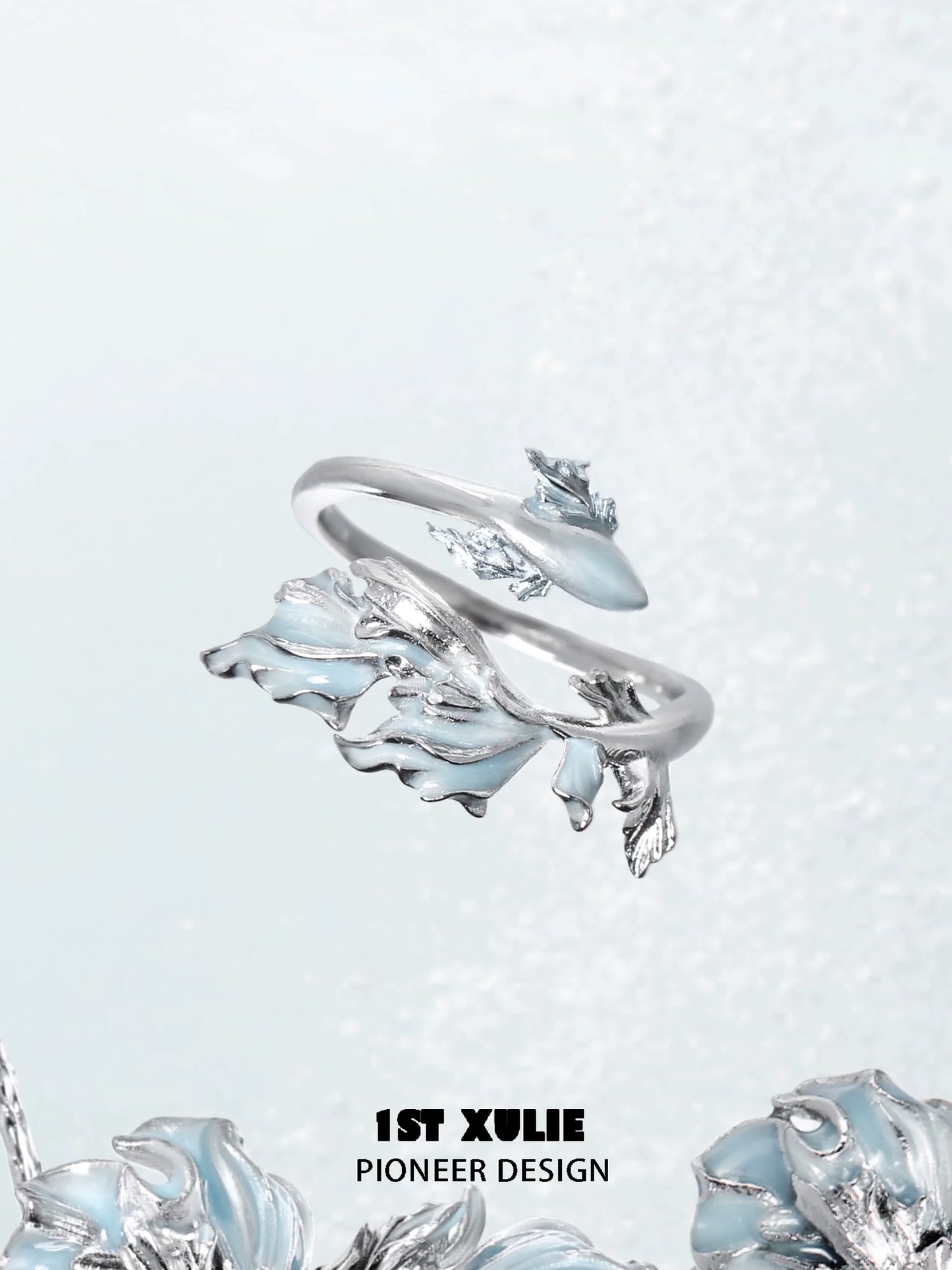 Mermaid tail silver ring featuring intricate wave designs and a polished finish