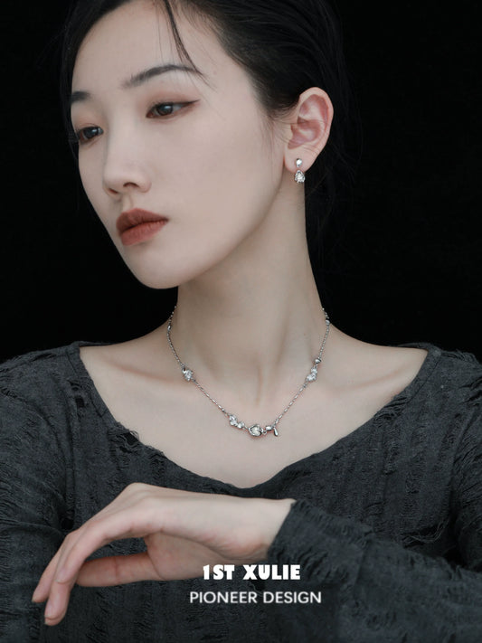 Elegant model wearing moonlit agate earrings paired with a matching necklace for a sophisticated look