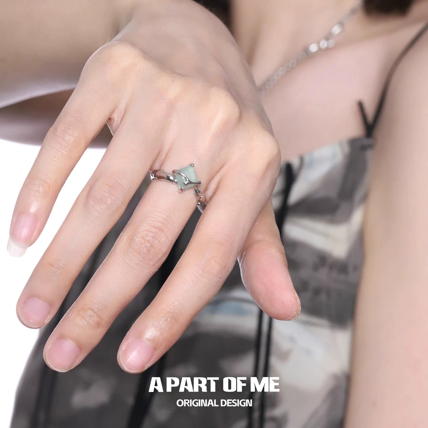 A unique silver gothic ring displayed on a hand showcasing its intricate design and craftsmanship