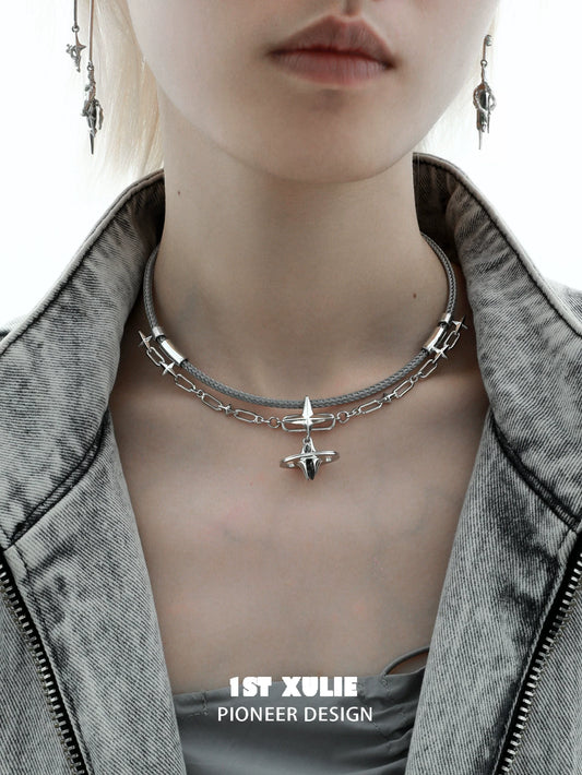 Punk dreamcore necklace by 1STXULIE featuring a layered silver design with spikes and chains