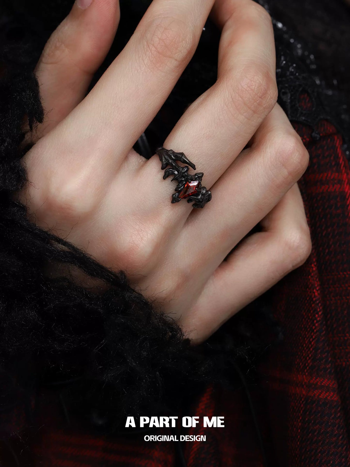 A PART OF ME ruby dragon wing ring featuring a detailed dragon design on a hand
