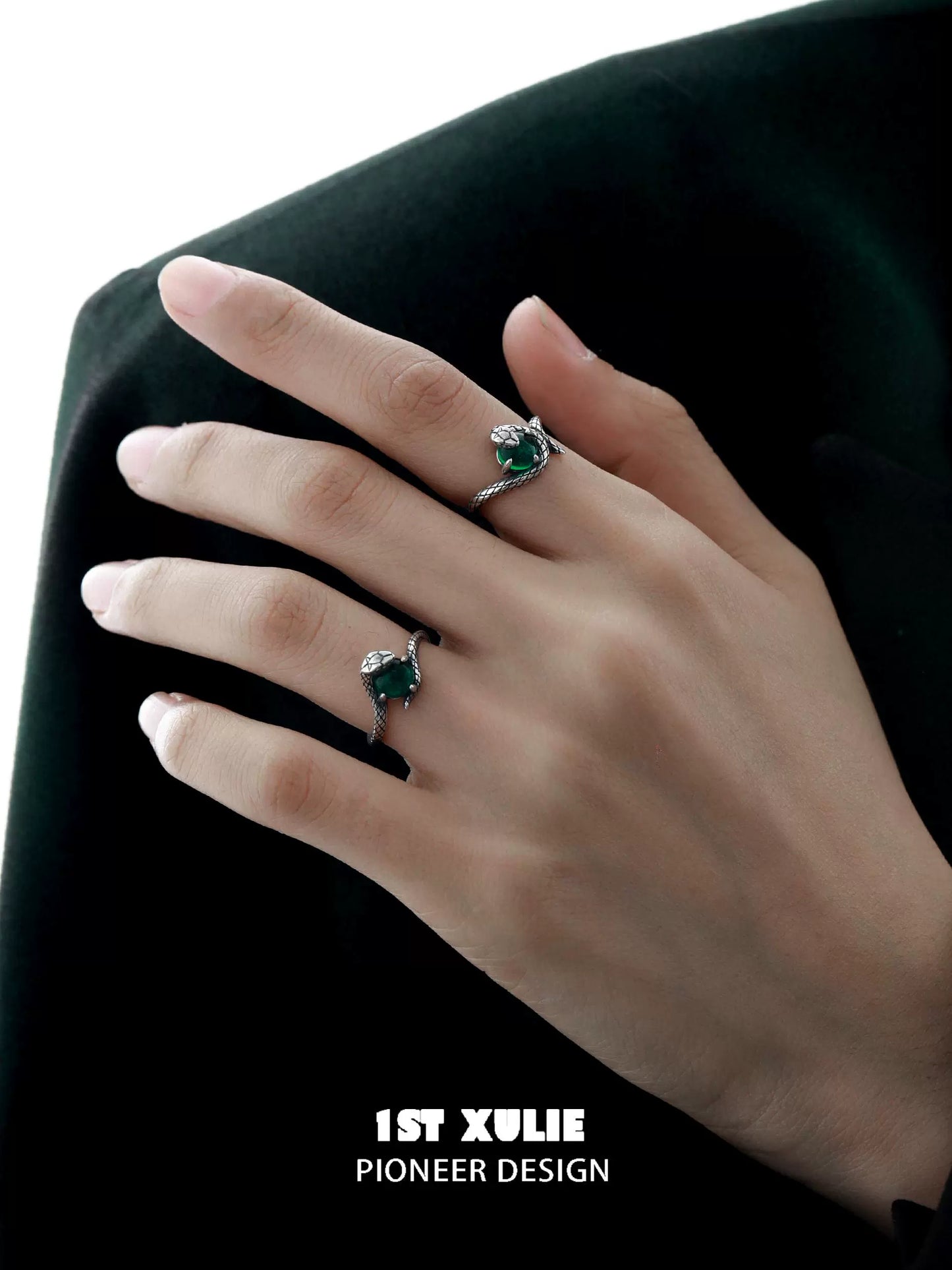 Slytherin snake silver ring featuring a green stone and intricate design on a hand