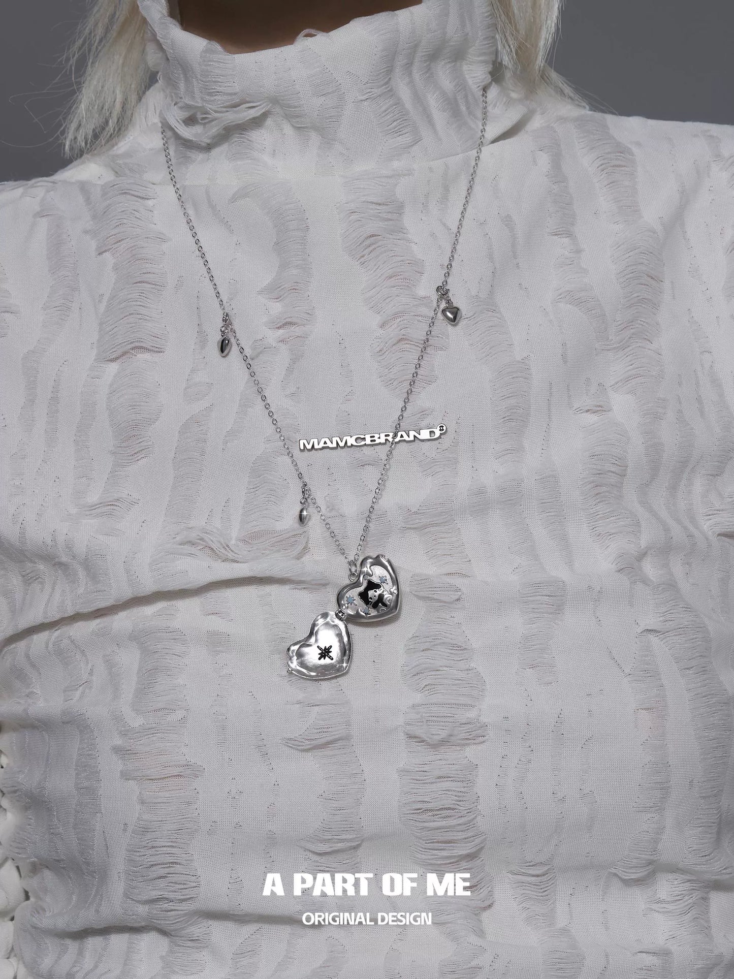 Silver snow kitten love pendant necklace featuring two heart charms for a stylish look