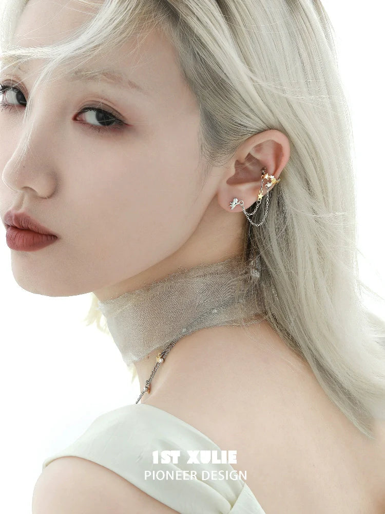 Fashionable starlight ear cuff with elegant design worn by a model with light hair