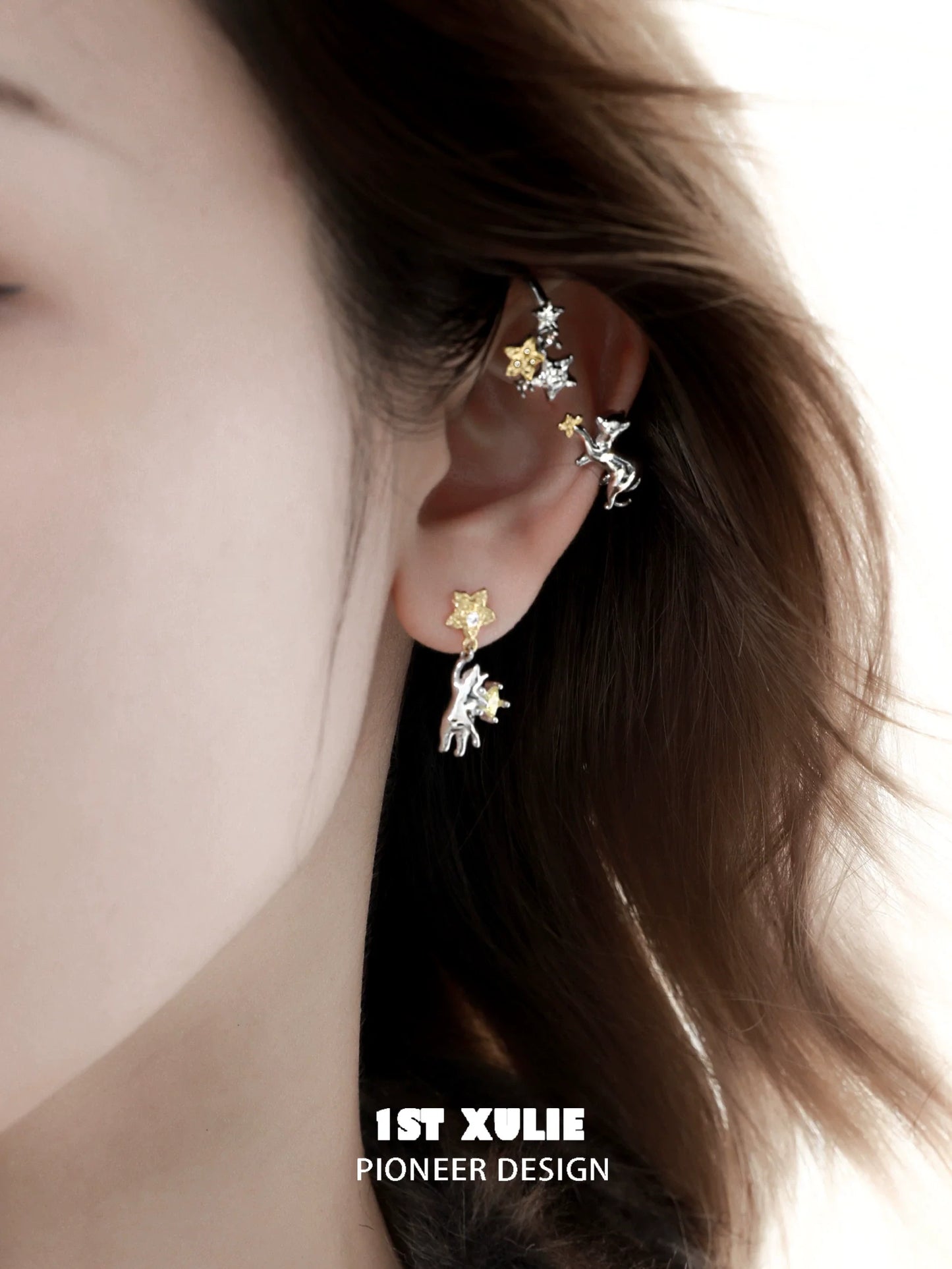 Starry cat ear cuff featuring silver and gold stars designed for unique fashion statements