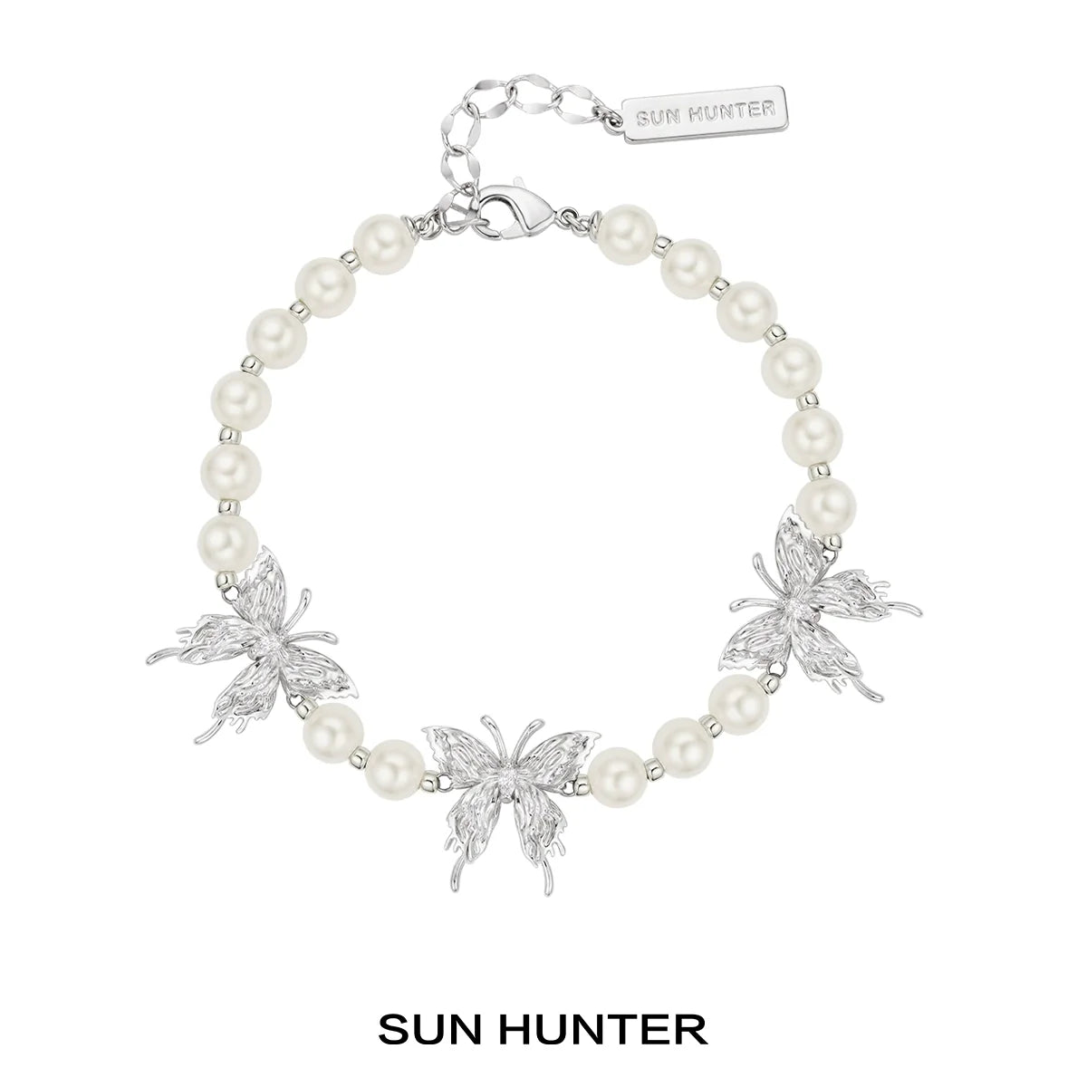 SUN HUNTER butterfly pearl bracelet featuring silver butterflies and elegant pearls