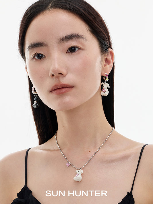 Sun Hunter jewelry cute rabbit necklace for women with playful charm, worn by a model with earrings