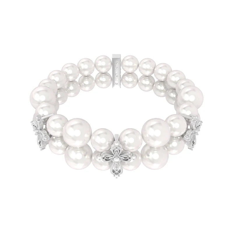Elegant vintage cross pearl bracelet featuring lustrous pearls and intricate cross embellishments