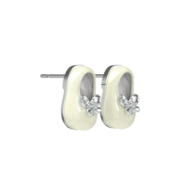 SUN HUNTER vintage walking shoe earrings featuring a floral design and elegant enamel finish