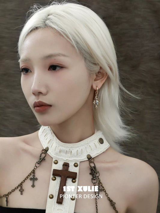 Model wearing Y2K cross earrings, showcasing a trendy and stylish design for modern fashion.