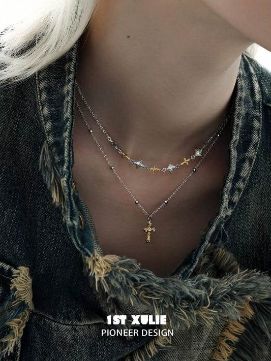 Y2K cross necklace layered with silver and gold accents for a trendy look