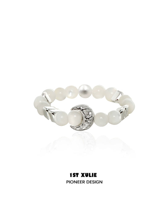 Beaded shell pearl silver ring from 1STXULIE featuring elegant design and unique texture.