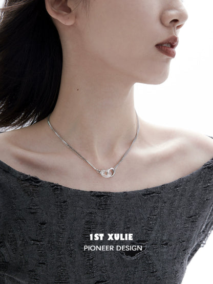 Black and white gothic necklace displayed on model with modern outfit and minimalistic design