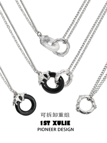 1ST XULIE black and white gothic necklace featuring interlocking rings and chain details