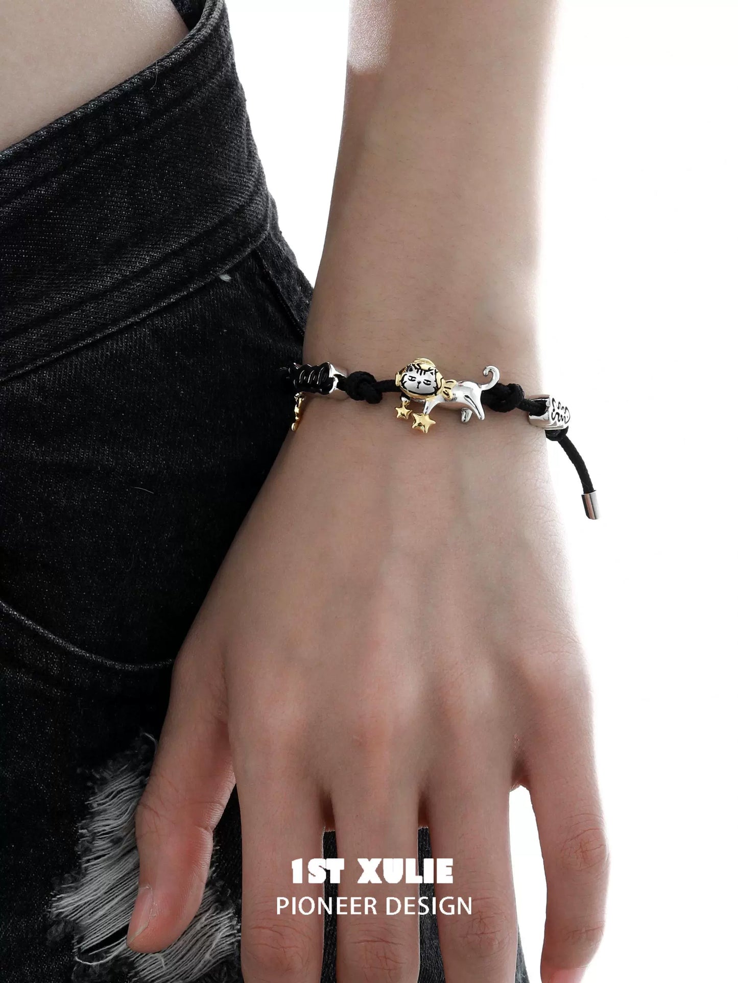Stylish black kitty leather bracelet featuring a cute cat charm and star accents for trendy outfits