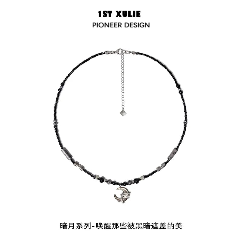 Black moon agate necklace featuring unique beads and a stylish charm for elegant looks