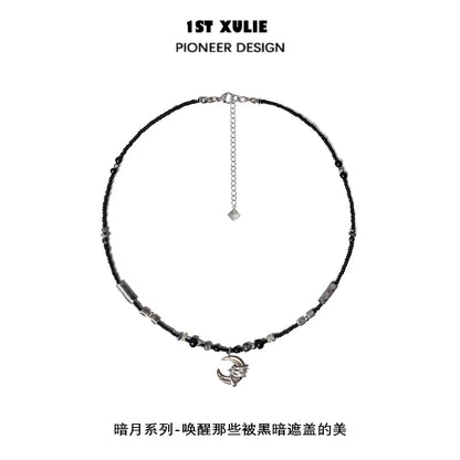 Black moon agate necklace featuring unique beads and a stylish charm for elegant looks