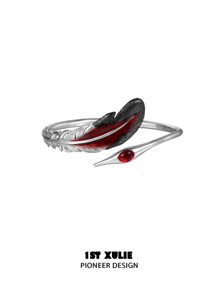 1STXULIE bloody feather bracelet with a silver base and red enamel detailing