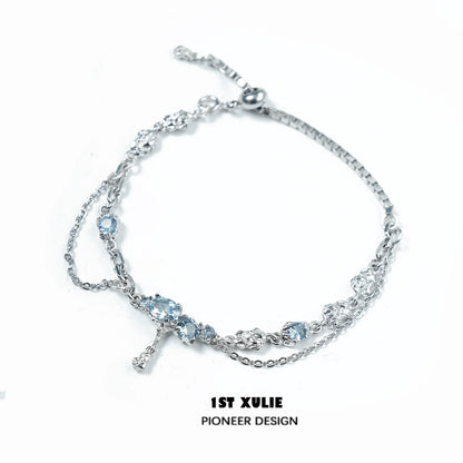 Elegant blue moonstone bracelet with silver chain, featuring multiple shimmering stones
