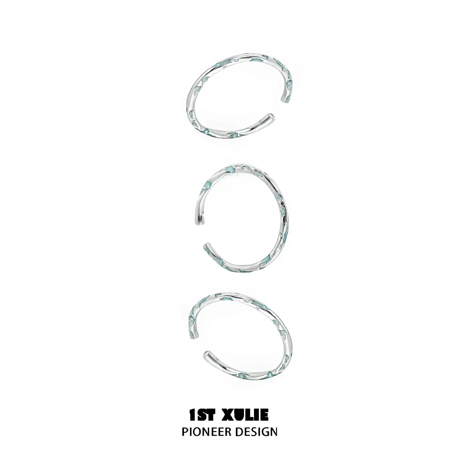 Set of three unique rings featuring a blue textured silver ring design for stylish layering