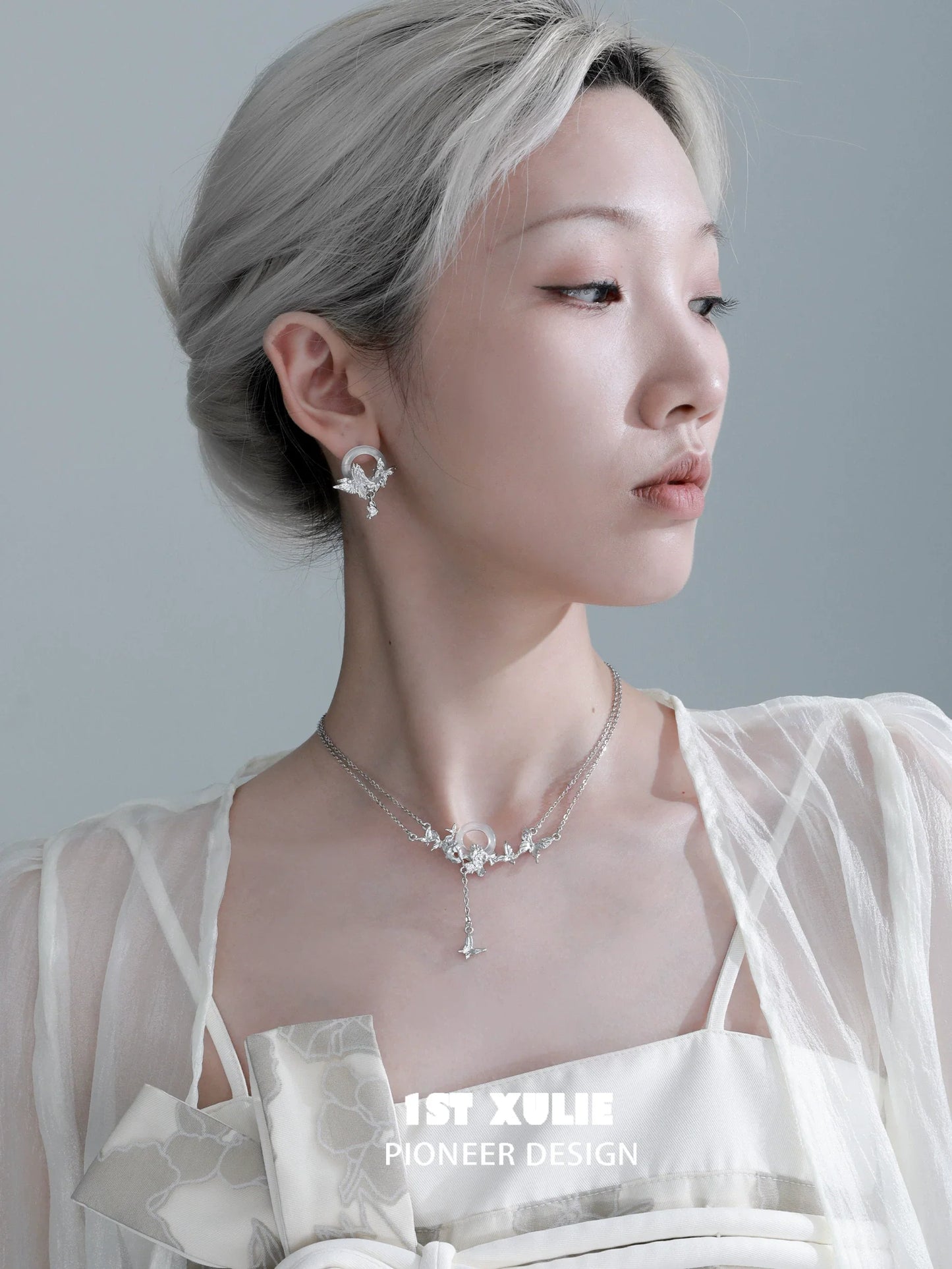Elegant butterfly chalcedony earrings displayed on a model, showcasing a delicate and unique design