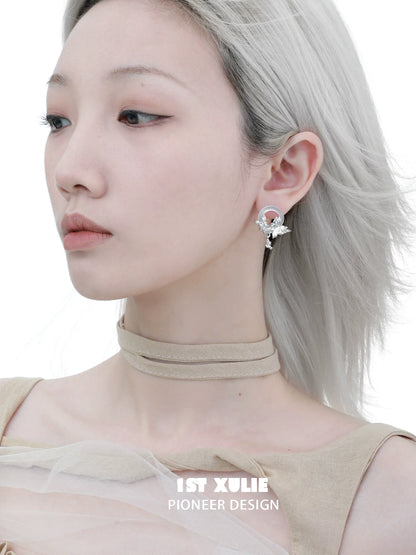 Elegant butterfly chalcedony earrings showcased on model with stylish accessories