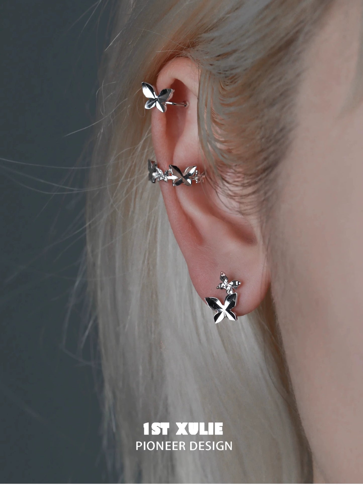 Stylish butterfly silver ear cuff featuring multiple butterfly designs for a trendy ear accessory