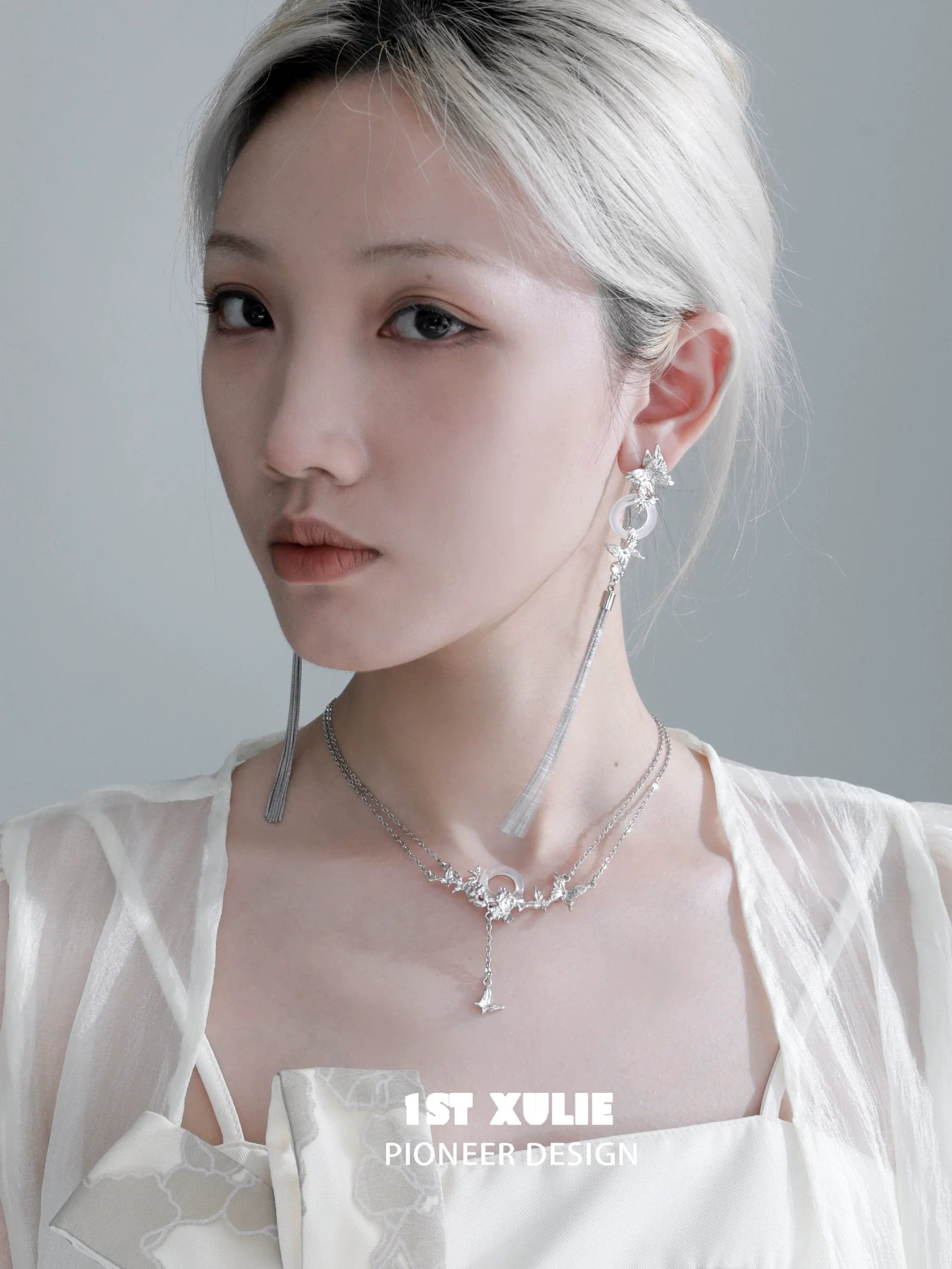 Elegant butterfly tassel earrings by 1STXULIE, featuring a unique design and shimmering details