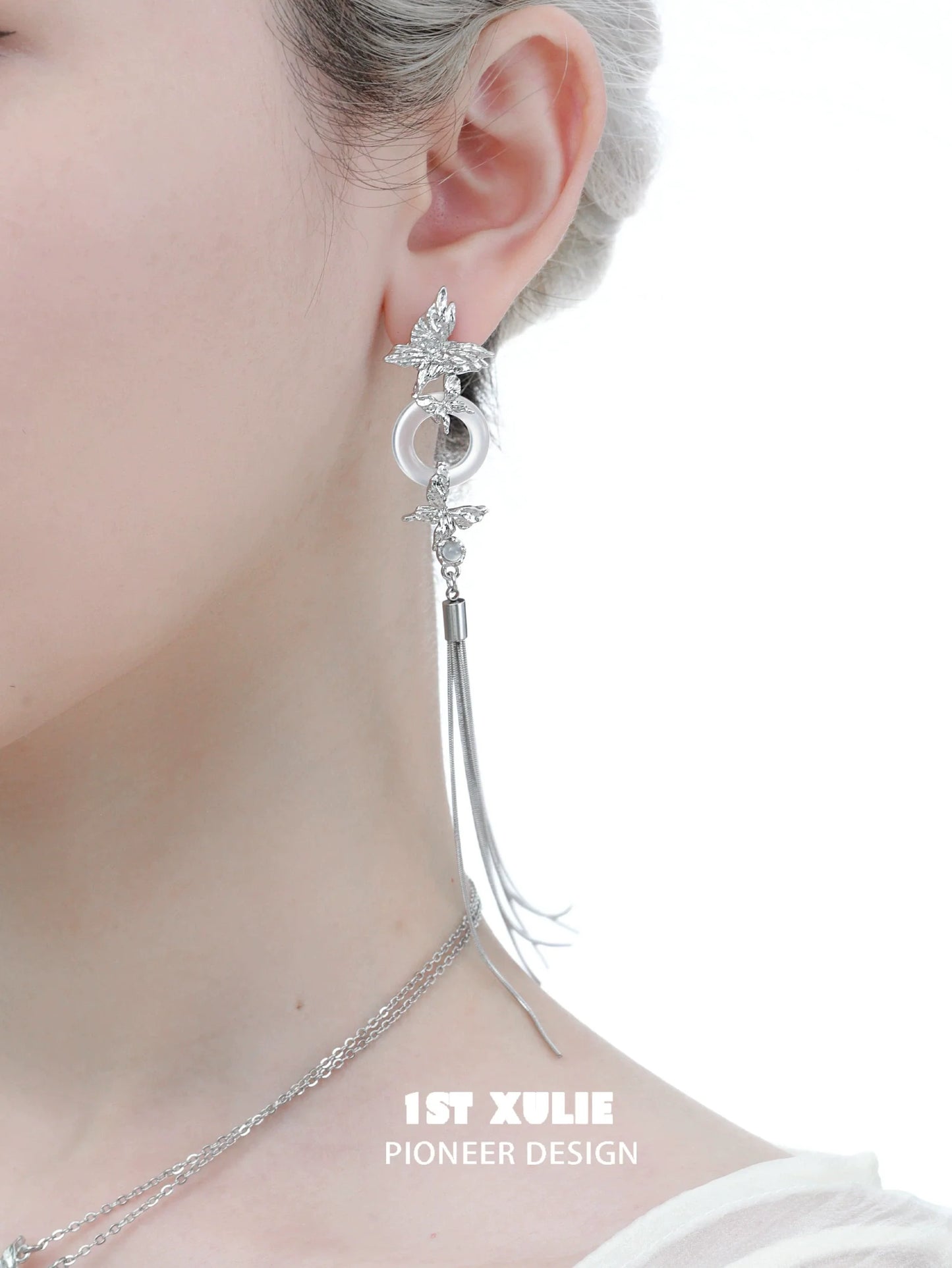 Elegant silver butterfly tassel earrings with intricate design and long dangling chain for a stylish look