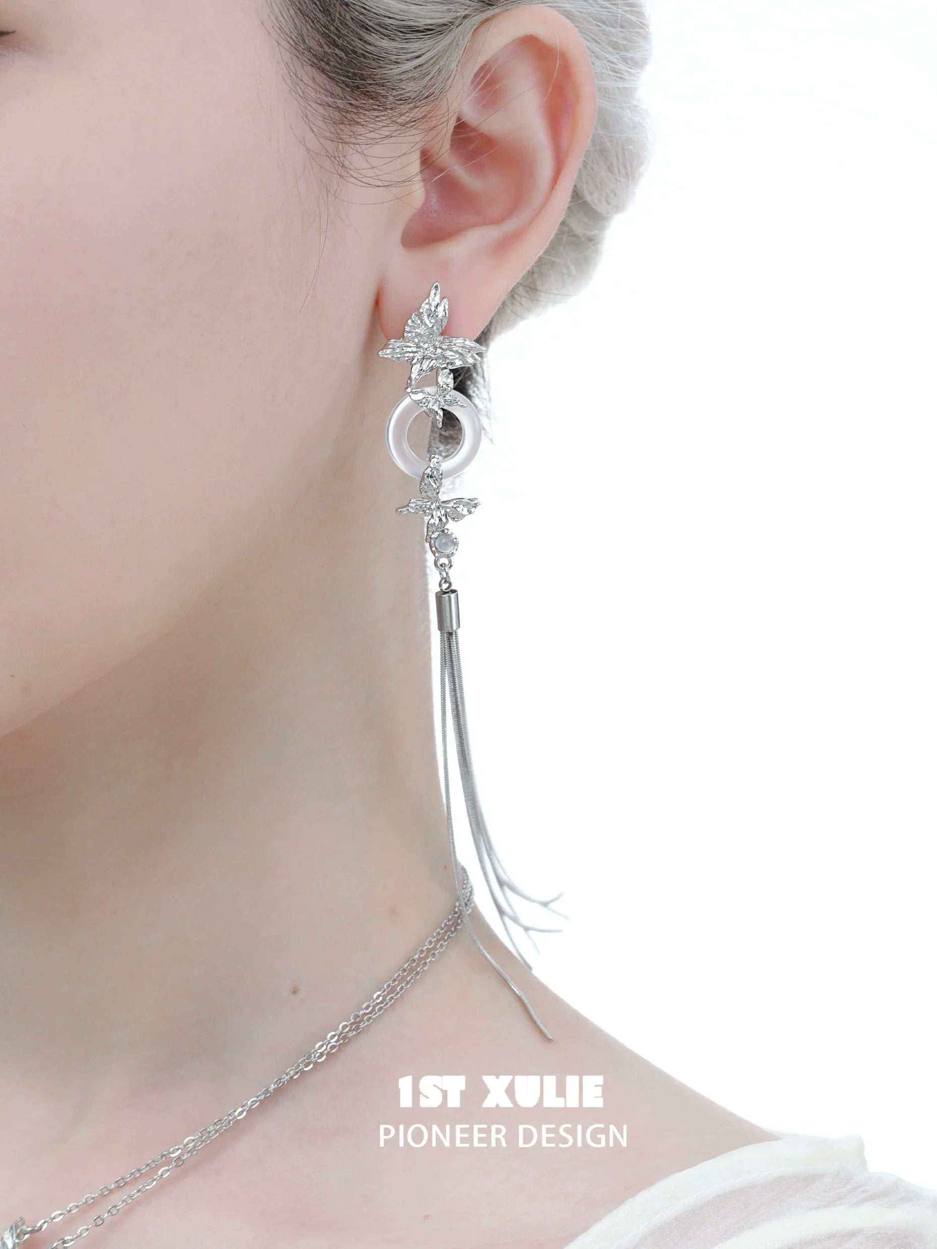 Elegant silver butterfly tassel earrings with intricate design and long dangling chain for a stylish look