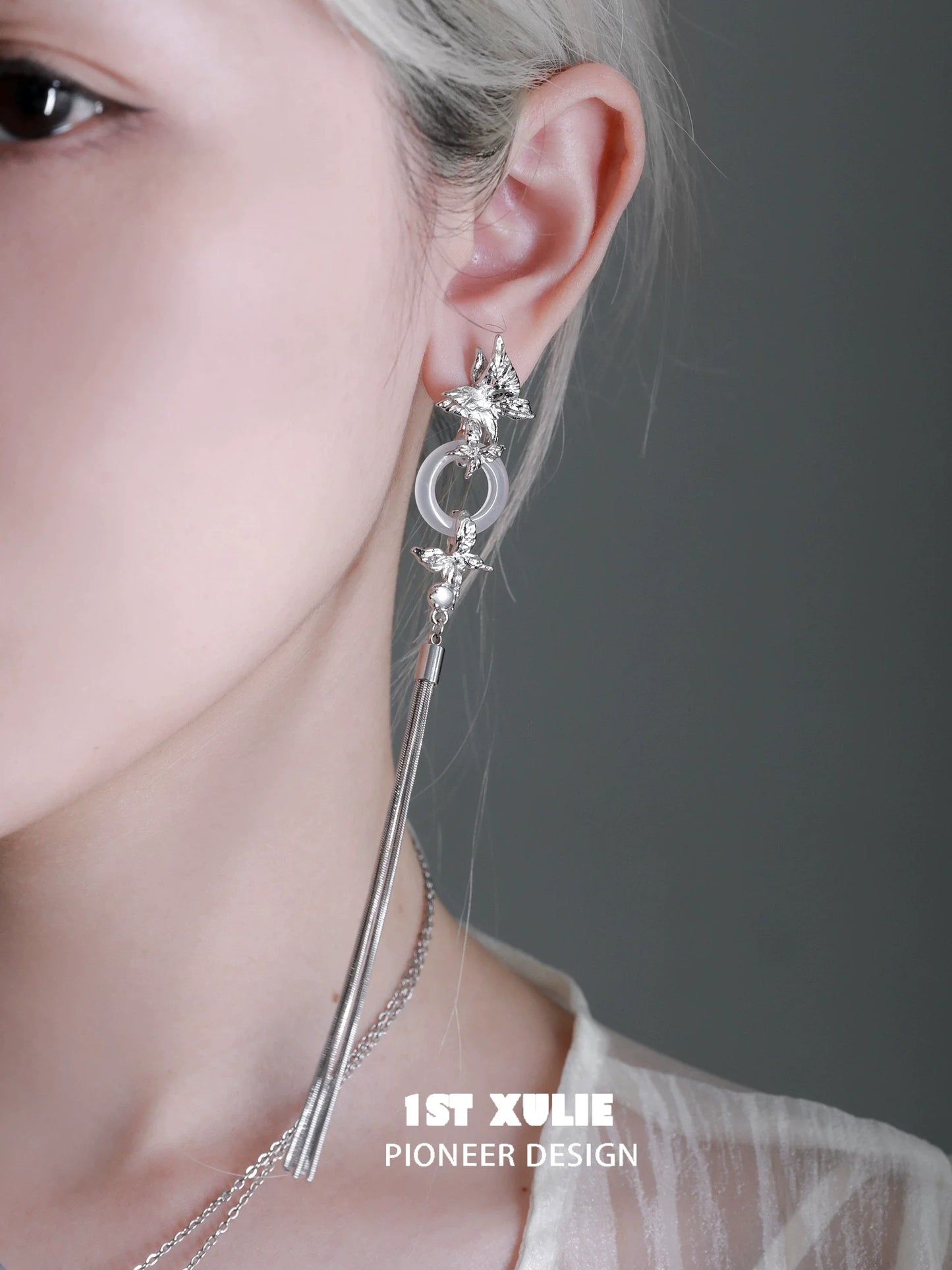 Elegant butterfly tassel earrings with silver accents, featuring a delicate design for a stylish look