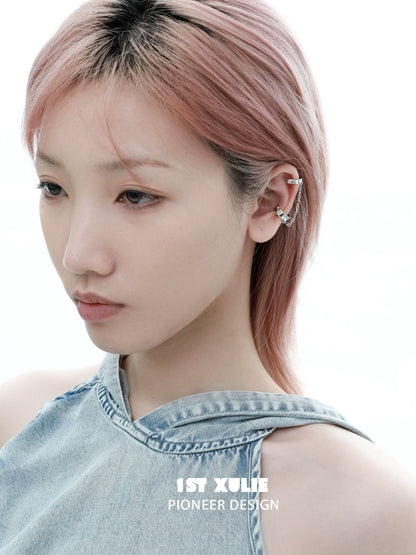 Model showcasing a sterling silver celestial ear cuff with unique design features