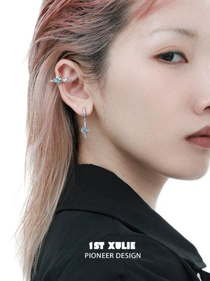 Celestial sea star earrings showcased on a model with pink hair, featuring a unique design by 1STXULIE