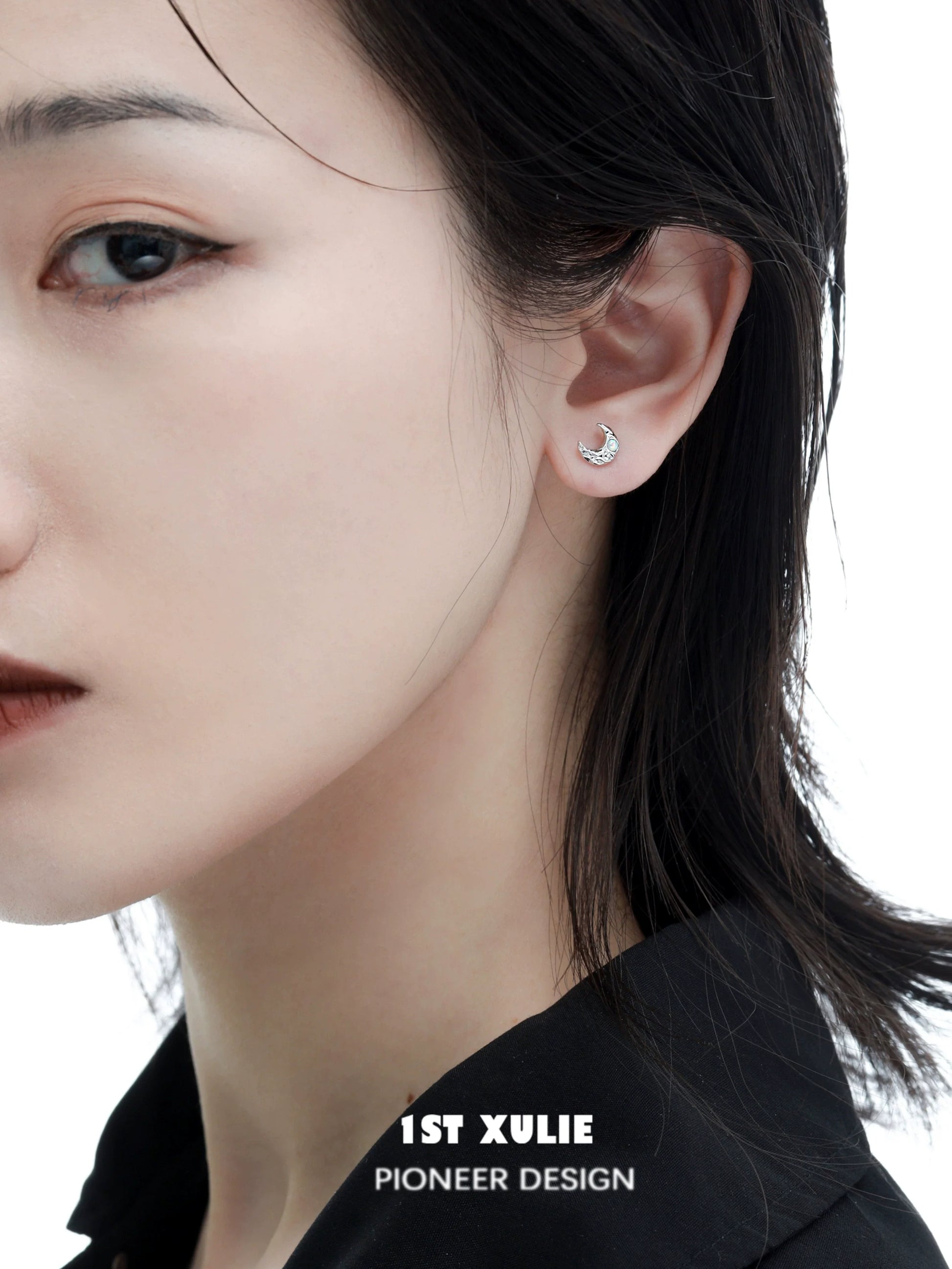 Elegant cosmic moon and star earrings featured on a model for a stylish look
