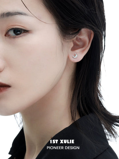 Elegant cosmic moon and star earrings featured on a model for a stylish look