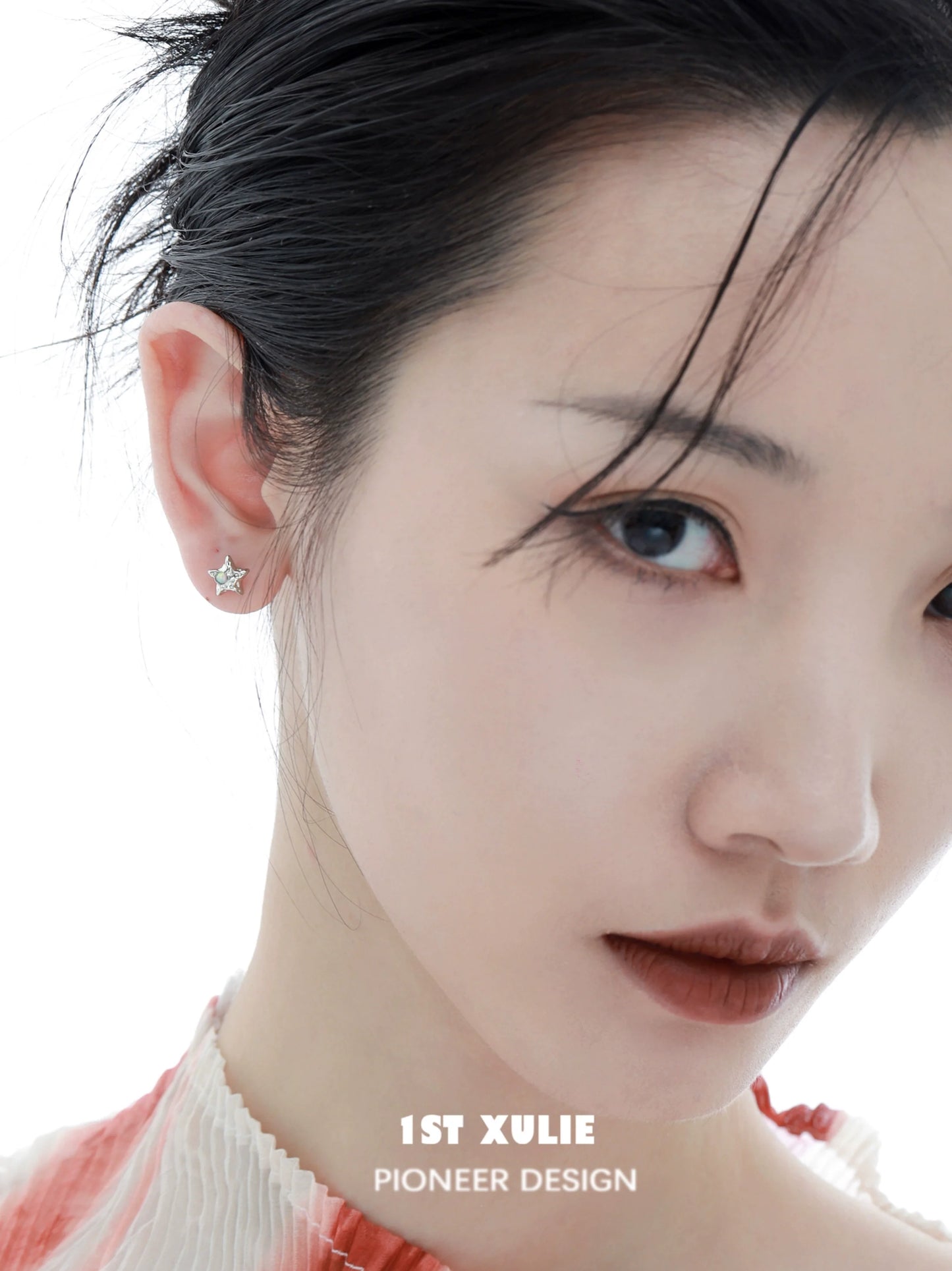 Elegant cosmic moon and star earrings for a celestial-inspired look, showcased on a model