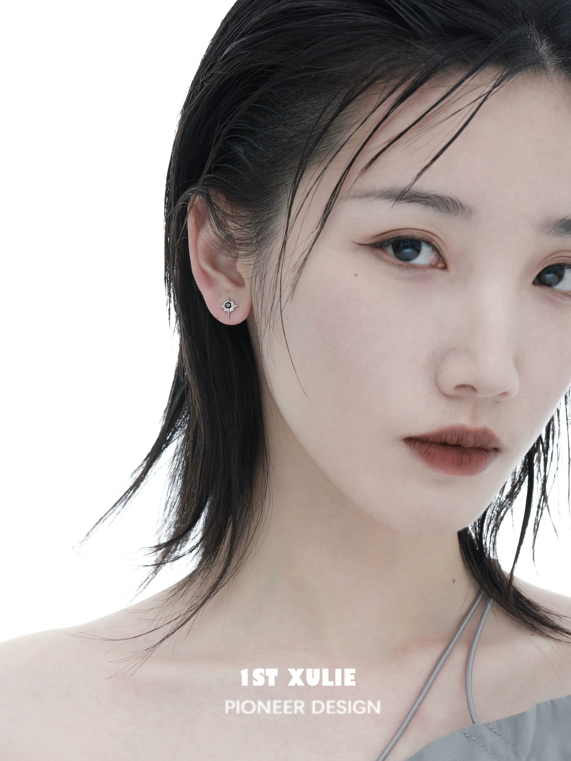 Elegant model showcasing 1ST XULIE cosmic star earrings for a trendy and stylish look
