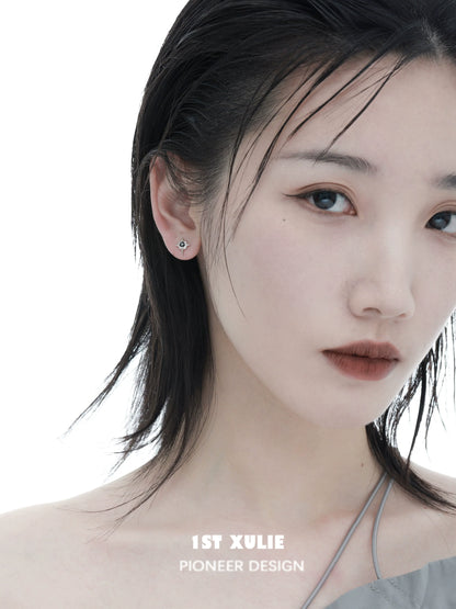 Elegant model showcasing 1ST XULIE cosmic star earrings for a trendy and stylish look