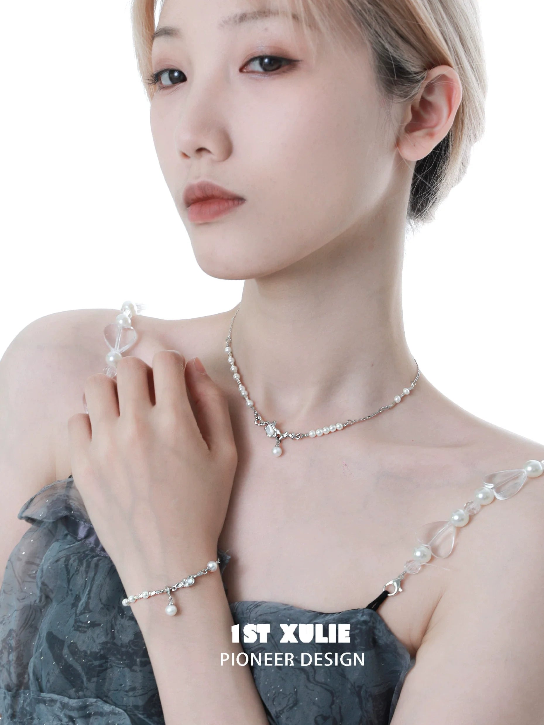 Model wearing a stylish crushed silver pearl necklace from 1ST XULIE showcasing its elegant design.