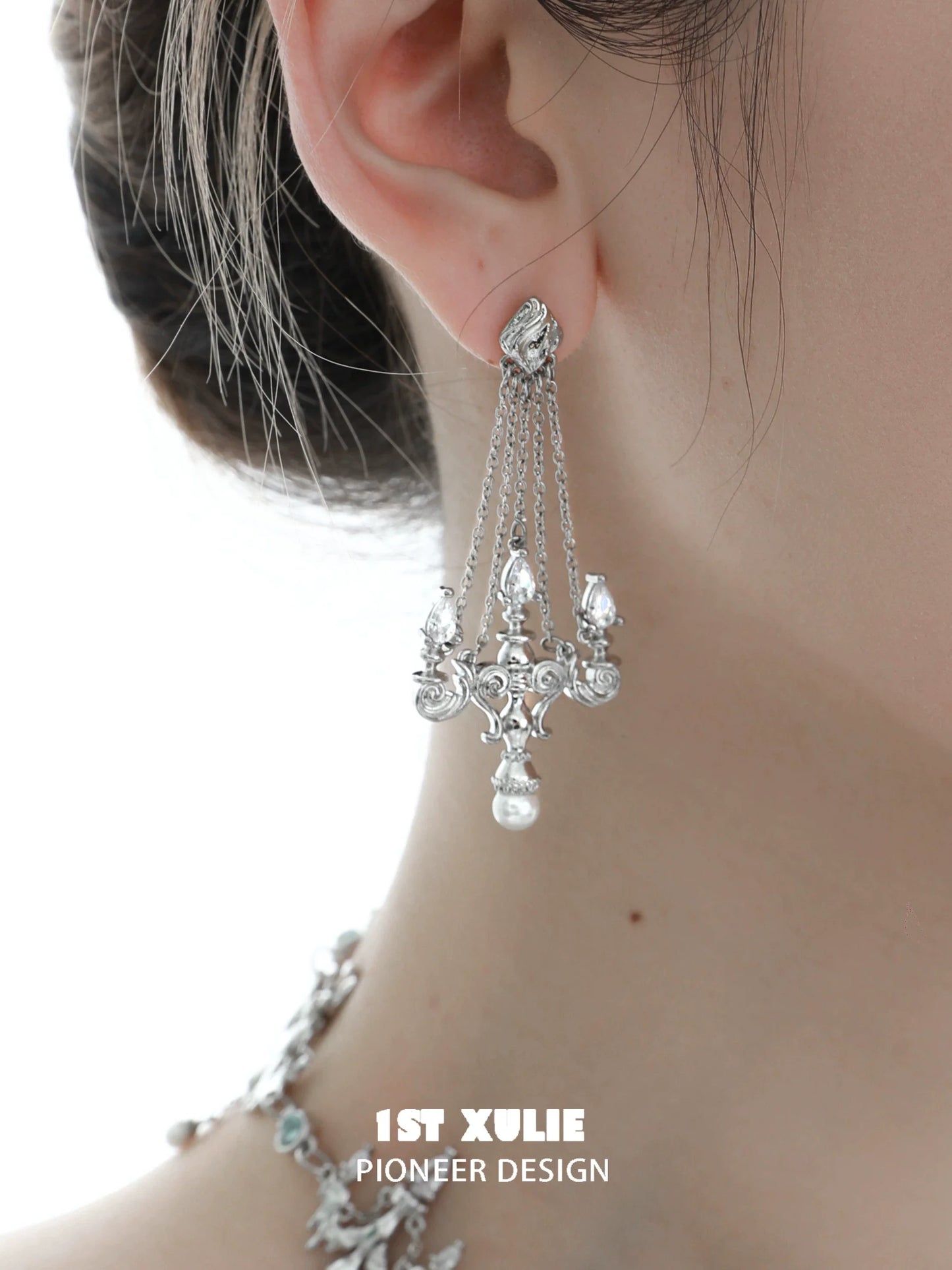 Elegant 1STXULIE crystal lamp earrings with intricate silver design and dangling chains