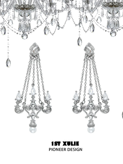 Elegant crystal lamp earrings with intricate designs and dangling chains from 1ST XULIE
