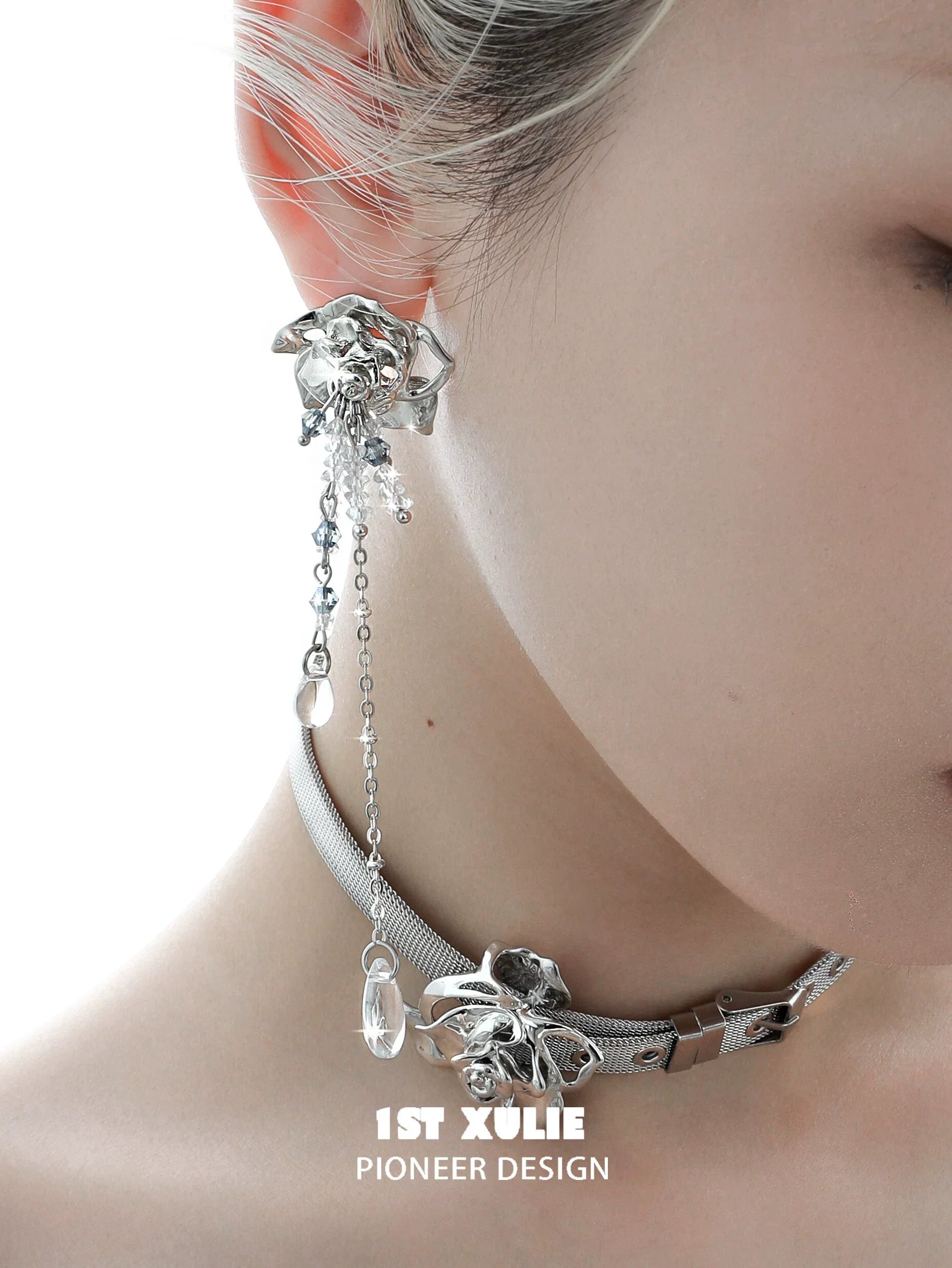 Elegant crystal rose tassel earrings featuring a silver design and intricate chain details
