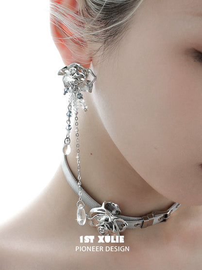 Elegant crystal rose tassel earrings featuring a silver design and intricate chain details