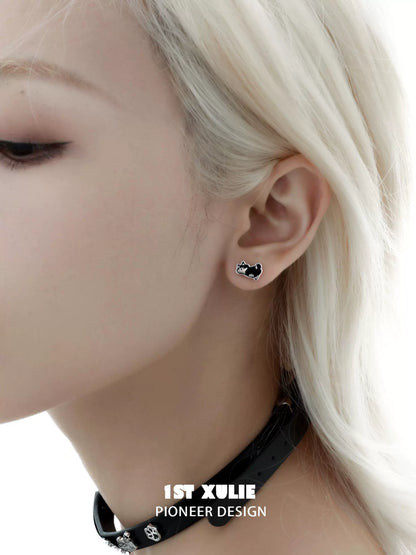 Cute puppy earrings in black design showcased on model with light hair and choker accessories