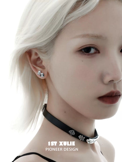 Cute puppy earrings in silver worn by a model with a chic hairstyle and striking features