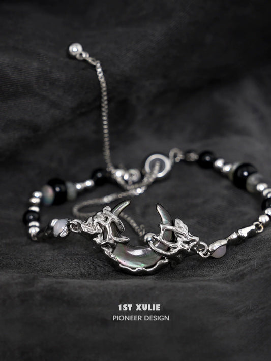 Stylish dark moon agate bracelet with silver accents and unique charm design for modern jewelry lovers