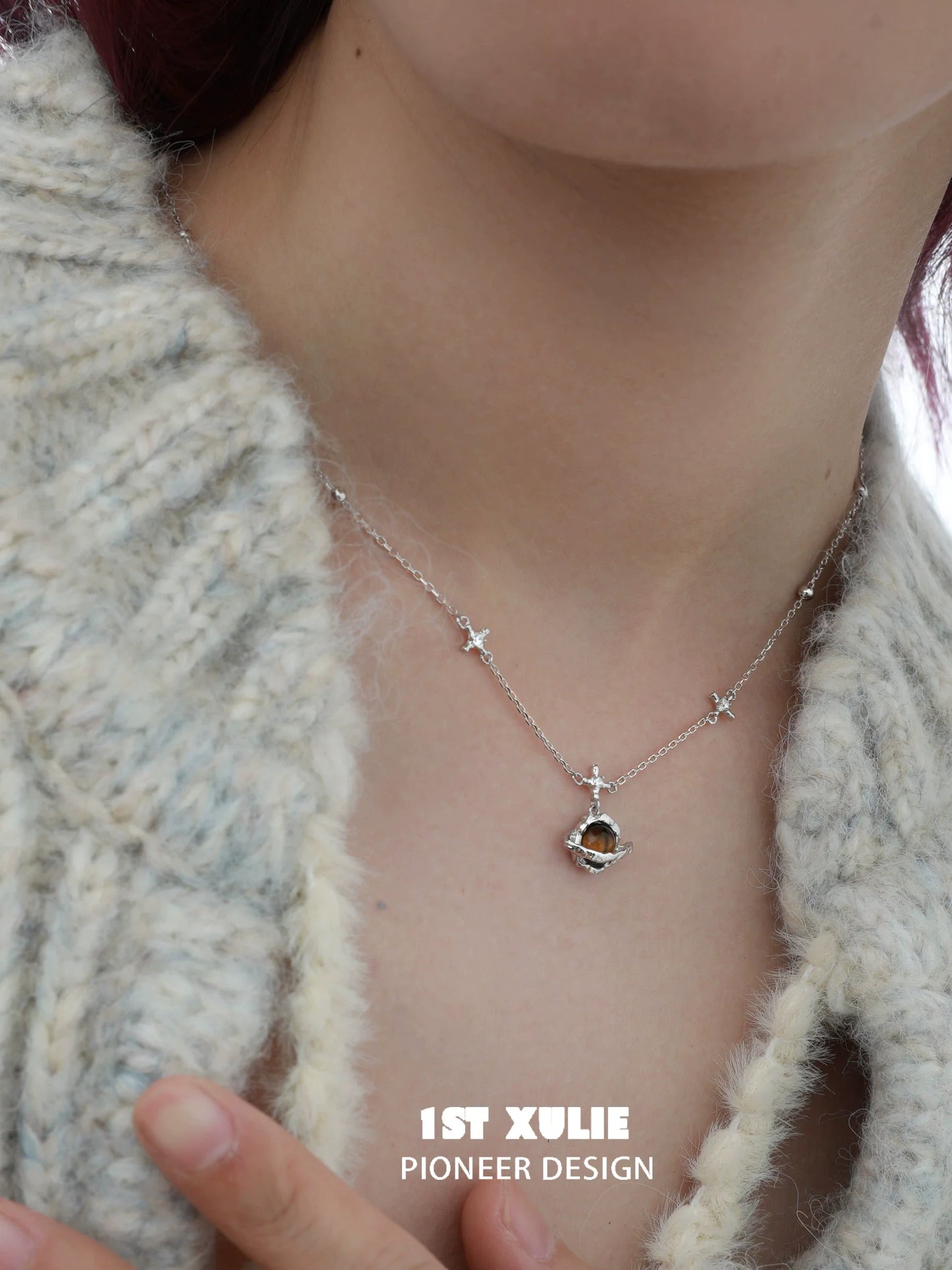 1ST XULIE Desert Planet Necklace featuring a celestial design with stars and a unique pendant