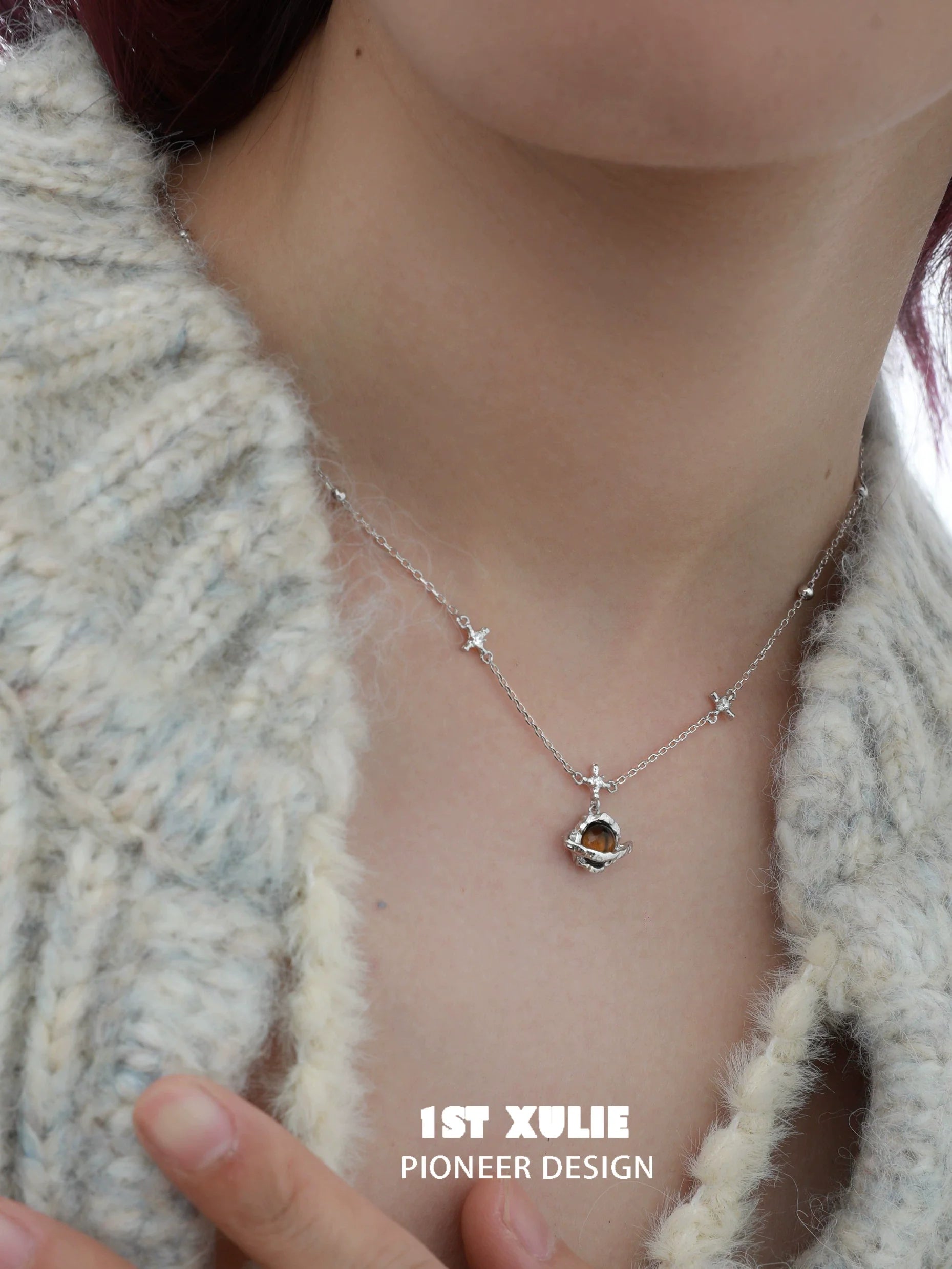 1ST XULIE Desert Planet Necklace featuring a celestial design with stars and a unique pendant